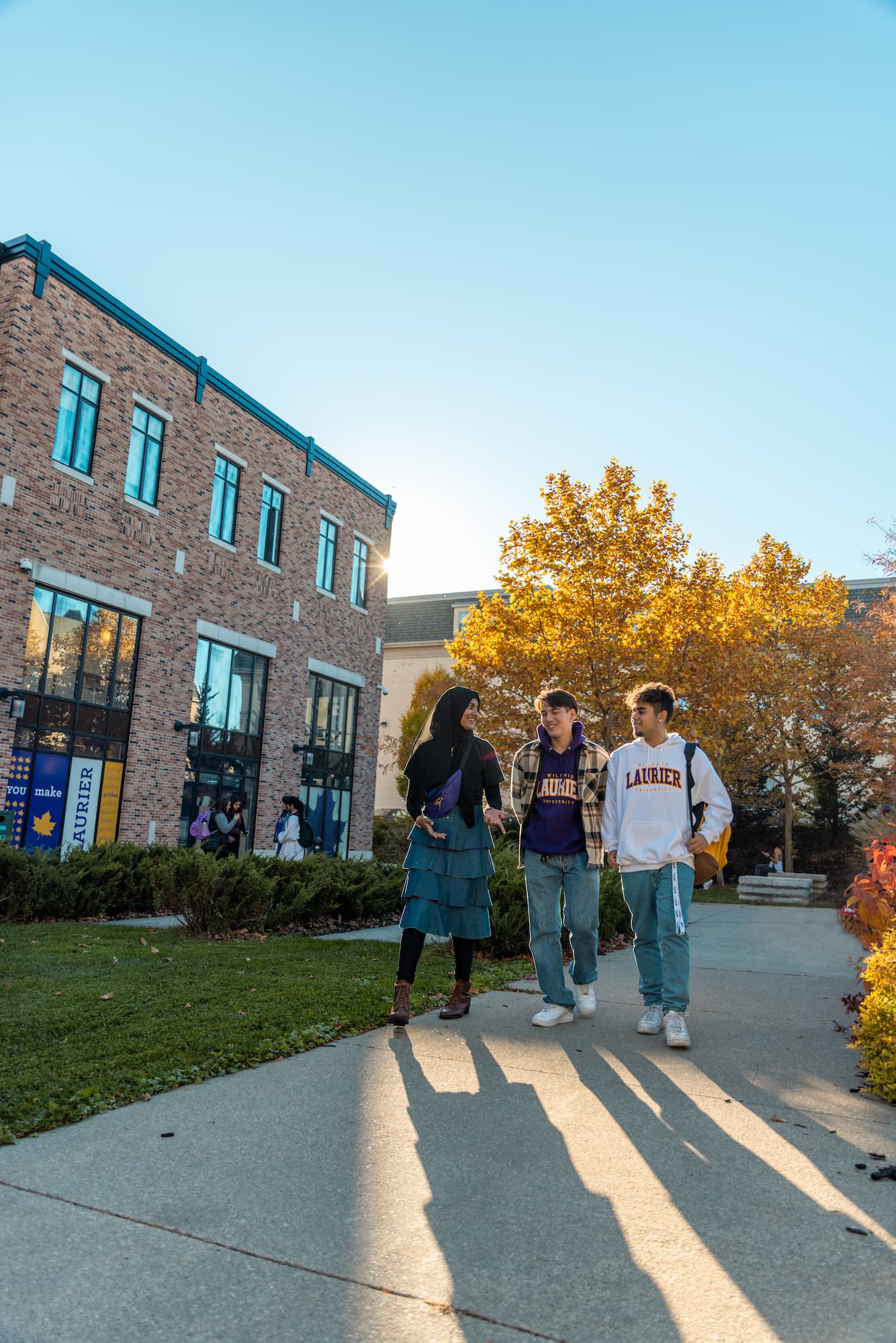 Students outside in autumn, Brantford campus