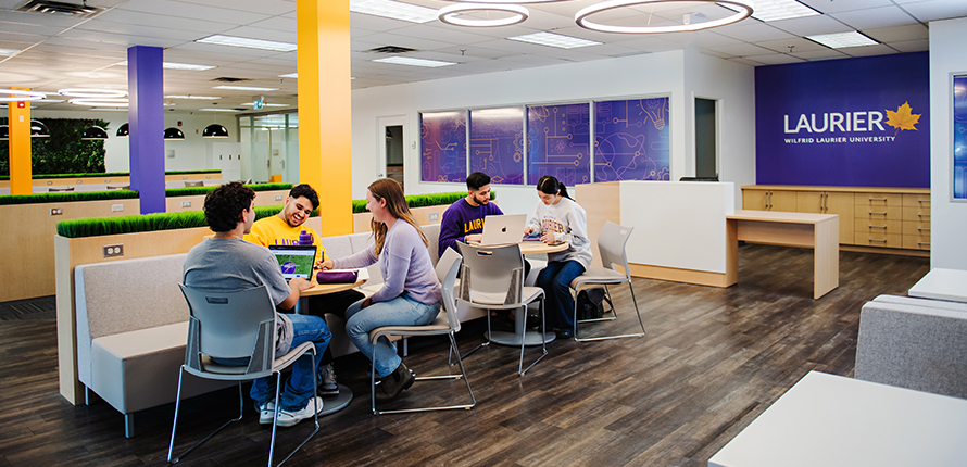 Students sitting at tables studying