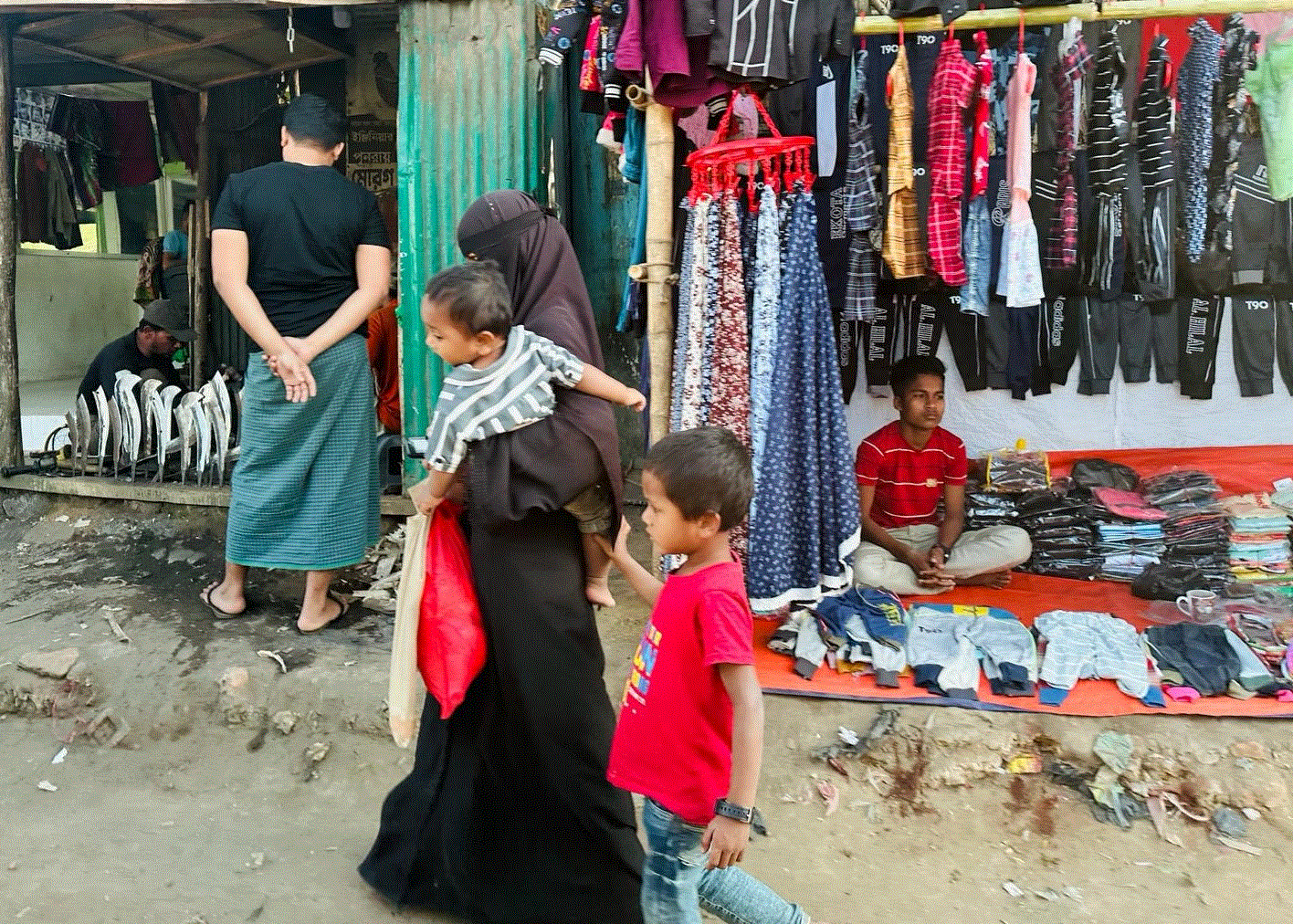 mother and children walking in market