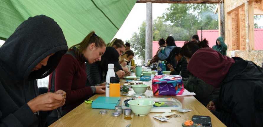 youths participating in beading activity