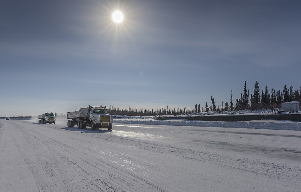 Trucks travelling across ice road