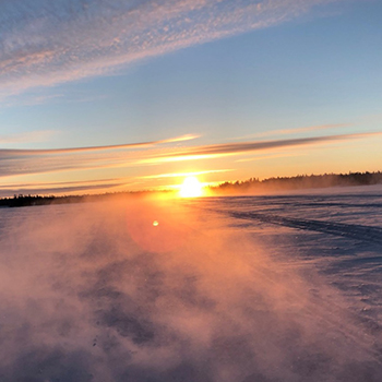 Sun rising over ice