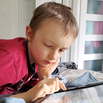 Young boy using iPad