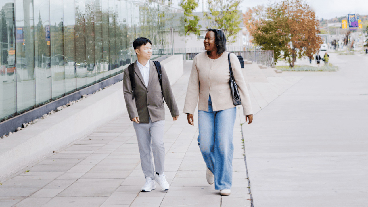 Students walking outside in front of Lazaridis Hall